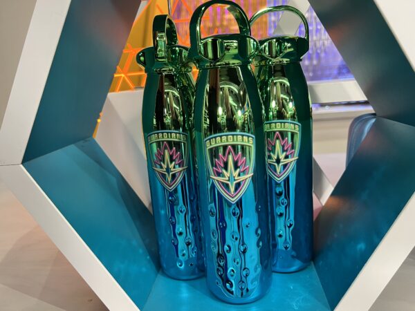Shimmering water bottles with the Guardians logo.