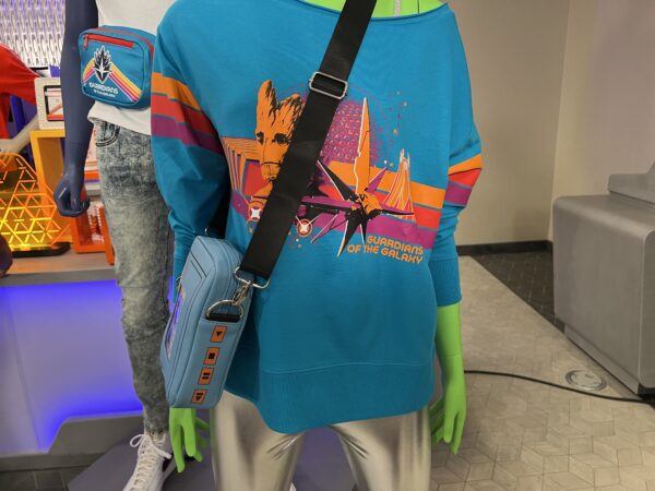 Blue shirt with Groot and ship.