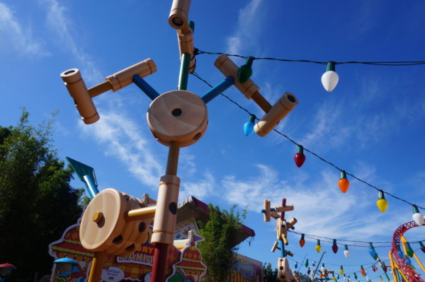 All of Toy Story Land is built out of classic toys like this Tinker Toy tower that supports the Christmas lights!