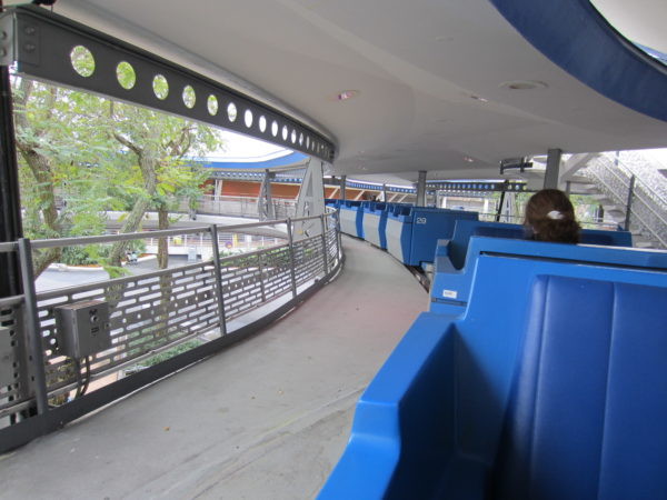 The Disney World TTA has open-air cars with a covered track.