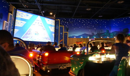 Take in some 1950's movie clips while enjoying a milkshake in an American classic car.