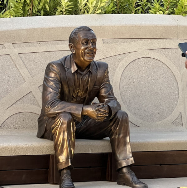 Walt is depicted later in his life, enjoying a sense of fulfillment at his accomplishments. 