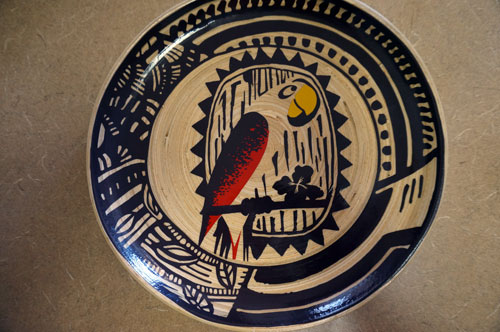 Two plates feature this parrot design.
