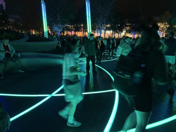 The lines of the EPCOT logo embedded in the ground light up and change color - it looks pretty amazing.